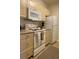 Bright kitchen with white appliances and light wood cabinets at 1300 Park West Blvd # 110, Mount Pleasant, SC 29466