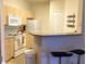 Well-equipped kitchen with white appliances and ample cabinetry at 1300 Park West Blvd # 110, Mount Pleasant, SC 29466