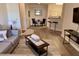 Spacious living room with light flooring and comfortable seating at 1300 Park West Blvd # 110, Mount Pleasant, SC 29466