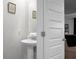 Small, updated powder room with pedestal sink and mirror at 149 Cypress Preserve Blvd, Moncks Corner, SC 29461
