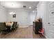 Dining room with a table, chandelier, hardwood floors, and view of entryway at 149 Cypress Preserve Blvd, Moncks Corner, SC 29461