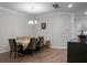 Dining room with a large table, chandelier, and hardwood floors at 149 Cypress Preserve Blvd, Moncks Corner, SC 29461