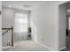 Bright hallway with carpeted flooring and natural light from window at 149 Cypress Preserve Blvd, Moncks Corner, SC 29461