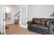 Home office with leather couch and French doors leading to another room at 149 Cypress Preserve Blvd, Moncks Corner, SC 29461