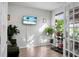 Home office with a leather couch, large TV and plenty of plants at 149 Cypress Preserve Blvd, Moncks Corner, SC 29461