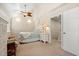 Primary bedroom with king bed, dresser, and access to a hallway at 149 High Hammock Villas, Seabrook Island, SC 29455