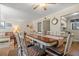 Open dining room with seating for six, adjacent to living room at 149 High Hammock Villas, Seabrook Island, SC 29455