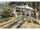 Back exterior showcasing patio and landscaping at 149 High Hammock Villas, Seabrook Island, SC 29455
