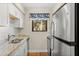 Updated kitchen featuring granite countertops and white cabinets at 149 High Hammock Villas, Seabrook Island, SC 29455