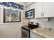 Modern kitchen with stainless steel appliances and granite countertops at 149 High Hammock Villas, Seabrook Island, SC 29455