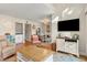 Bright living room with comfy seating, large TV, and access to a balcony at 149 High Hammock Villas, Seabrook Island, SC 29455