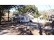 White house with mature trees and chain link fence at 1826 Helm Ave, North Charleston, SC 29405