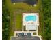 Community pool with surrounding green space and parking area at 212 Magnolia Garden Dr, Summerville, SC 29483