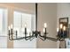Modern black chandelier with exposed bulbs at 212 Magnolia Garden Dr, Summerville, SC 29483