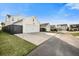 Two-story home with white exterior, attached garage, and fenced backyard at 212 Magnolia Garden Dr, Summerville, SC 29483
