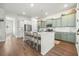 Open kitchen with green cabinets and white breakfast bar at 212 Magnolia Garden Dr, Summerville, SC 29483