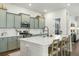 Modern kitchen with stainless steel appliances and light green cabinets at 212 Magnolia Garden Dr, Summerville, SC 29483