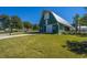 Charming green barn with white doors and metal roof at 225 Witherspoon St, Summerville, SC 29486