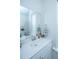 Clean bathroom with white vanity and large mirror at 225 Witherspoon St, Summerville, SC 29486
