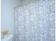 Simple bathroom with floral shower curtain and toilet at 225 Witherspoon St, Summerville, SC 29486