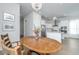 Dining room with wood table and view into kitchen area at 225 Witherspoon St, Summerville, SC 29486