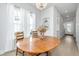 Dining room with wood table, chandelier, and view of kitchen at 225 Witherspoon St, Summerville, SC 29486