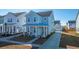 Two-story light blue house with front porch at 225 Witherspoon St, Summerville, SC 29486