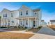 Two-story house with light blue siding, front porch, and driveway at 225 Witherspoon St, Summerville, SC 29486