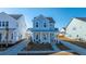 Two-story light blue house with front porch at 225 Witherspoon St, Summerville, SC 29486