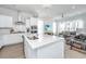 Open concept kitchen with island and living room view at 225 Witherspoon St, Summerville, SC 29486