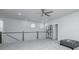 Bright loft bedroom with grey carpet and ceiling fan at 225 Witherspoon St, Summerville, SC 29486