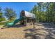 Community playground with a wooden playhouse, slide, and swings at 225 Witherspoon St, Summerville, SC 29486