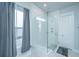 Walk-in shower with glass enclosure and marble flooring at 225 Witherspoon St, Summerville, SC 29486