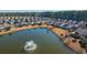 Aerial view of homes surrounding a pond with fountain at 234 Sea Lavender Ln, Summerville, SC 29486