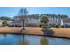 Backyard of home with pond view and trees at 234 Sea Lavender Ln, Summerville, SC 29486