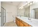 Double vanity bathroom with shower and tile flooring at 234 Sea Lavender Ln, Summerville, SC 29486
