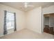 Bright bedroom with carpet flooring, window, and ceiling fan at 234 Sea Lavender Ln, Summerville, SC 29486