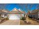 Attached garage with driveway and landscaping at 234 Sea Lavender Ln, Summerville, SC 29486