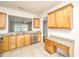 Kitchen boasts granite countertops and ample wood cabinets at 234 Sea Lavender Ln, Summerville, SC 29486