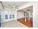 Sunroom with tile floors, ceiling fan, and view of backyard and pond at 234 Sea Lavender Ln, Summerville, SC 29486
