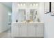 Double vanity bathroom with white cabinets and a view of the shower at 2700 Sunrose Ln, Johns Island, SC 29455