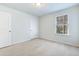 Bright bedroom with carpeted floors and a window at 2700 Sunrose Ln, Johns Island, SC 29455
