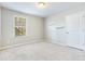 Bright bedroom with carpet, neutral walls, and shelves at 2700 Sunrose Ln, Johns Island, SC 29455