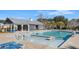 Inviting community pool with lounge chairs and covered seating area at 2700 Sunrose Ln, Johns Island, SC 29455