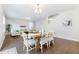 Dining room with hardwood floors, wooden table, and white chairs at 2700 Sunrose Ln, Johns Island, SC 29455