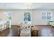Dining area with wooden table and bench, sliding doors leading to backyard at 2700 Sunrose Ln, Johns Island, SC 29455