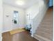 Bright entryway with hardwood floors, staircase, and bench at 2700 Sunrose Ln, Johns Island, SC 29455