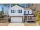 Two-story house with brick and siding, gray shutters, and a two-car garage at 2700 Sunrose Ln, Johns Island, SC 29455