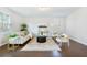 Living room with hardwood floors, beige sofa, and two armchairs at 2700 Sunrose Ln, Johns Island, SC 29455