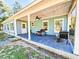 Covered back porch with seating and a grill at 273 Plantation Ln, Walterboro, SC 29488
